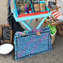 recycled bailing twine mat on display at market